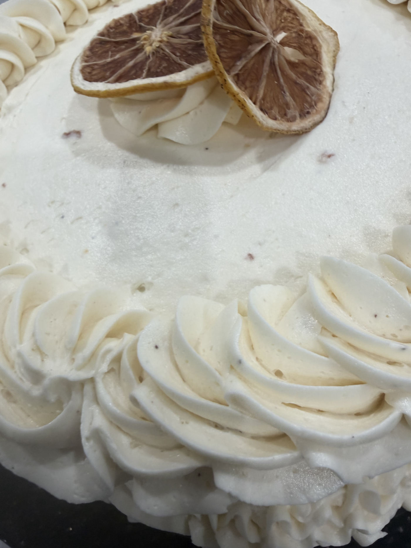 Elegant rosette cake with dried citrus by RizziBakes