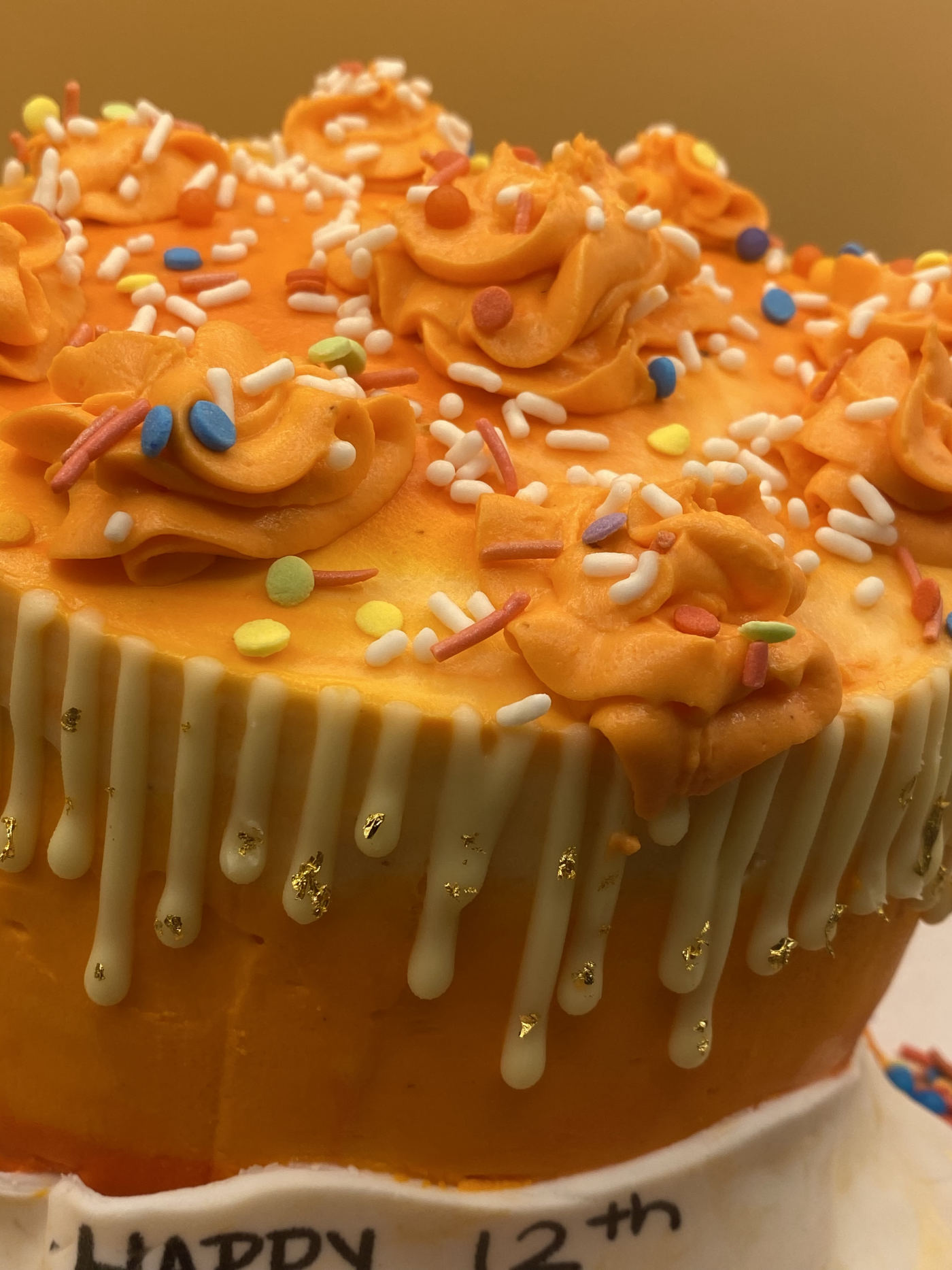 Orange buttercream birthday cake by RizziBakes